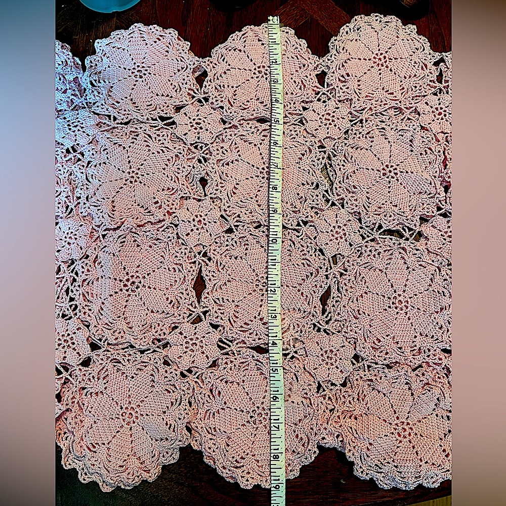 Hand crocheted table runner. Color is medium pink. The length will be doubled.